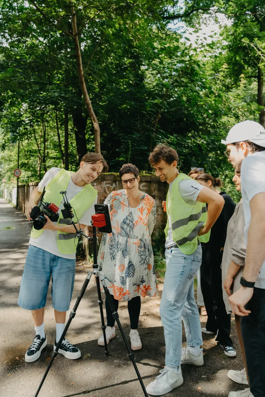 K&R behind the scenes: team reviewing footage outdoors