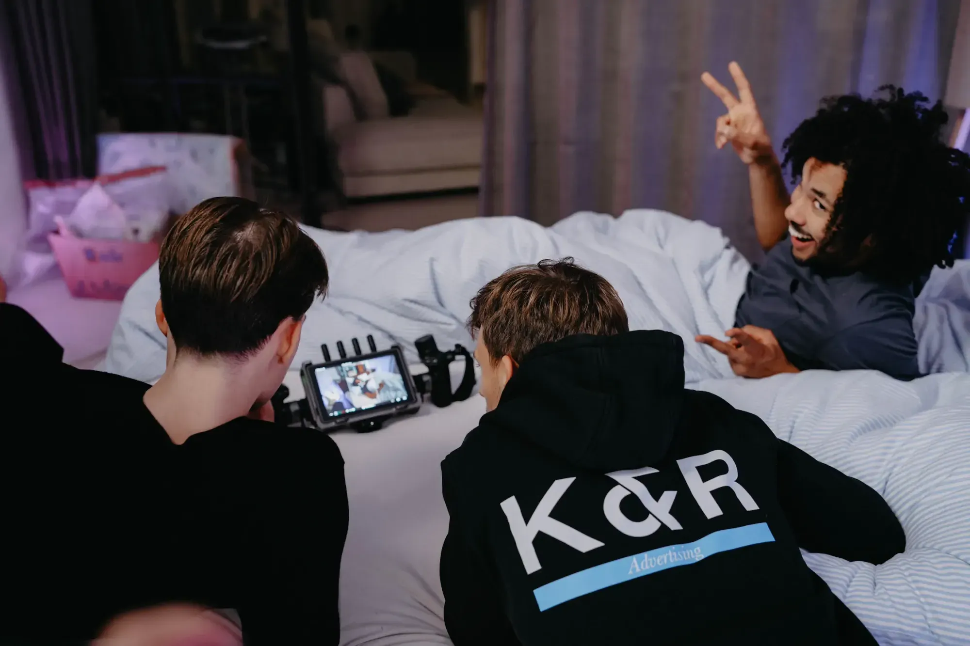 K&R behind the scenes: three men looking at a camera together
